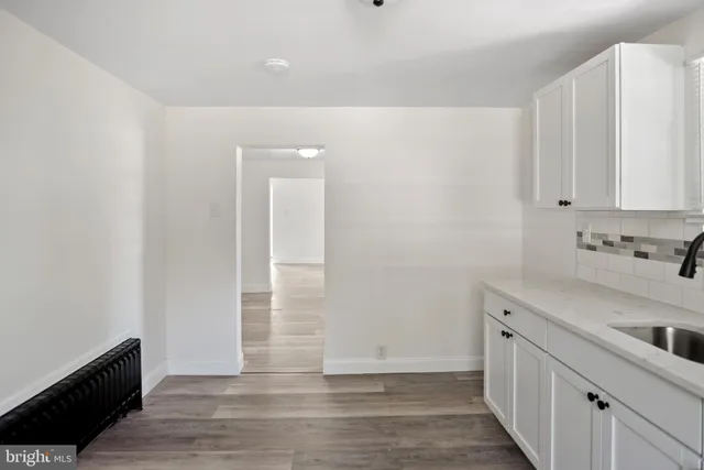 a view of a kitchen with sink and dishwasher