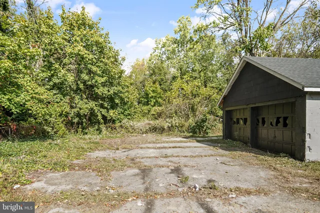 a view of wooden house and a yard