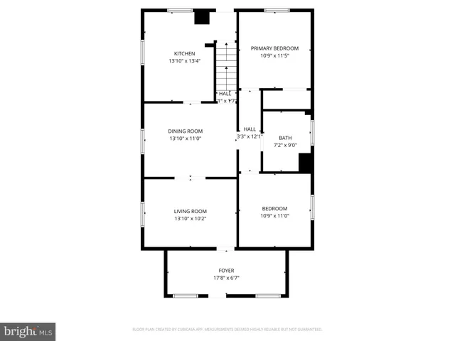 a picture of a bench in front of a wall