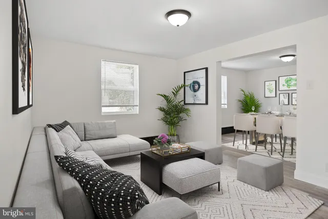 a living room with furniture and a table