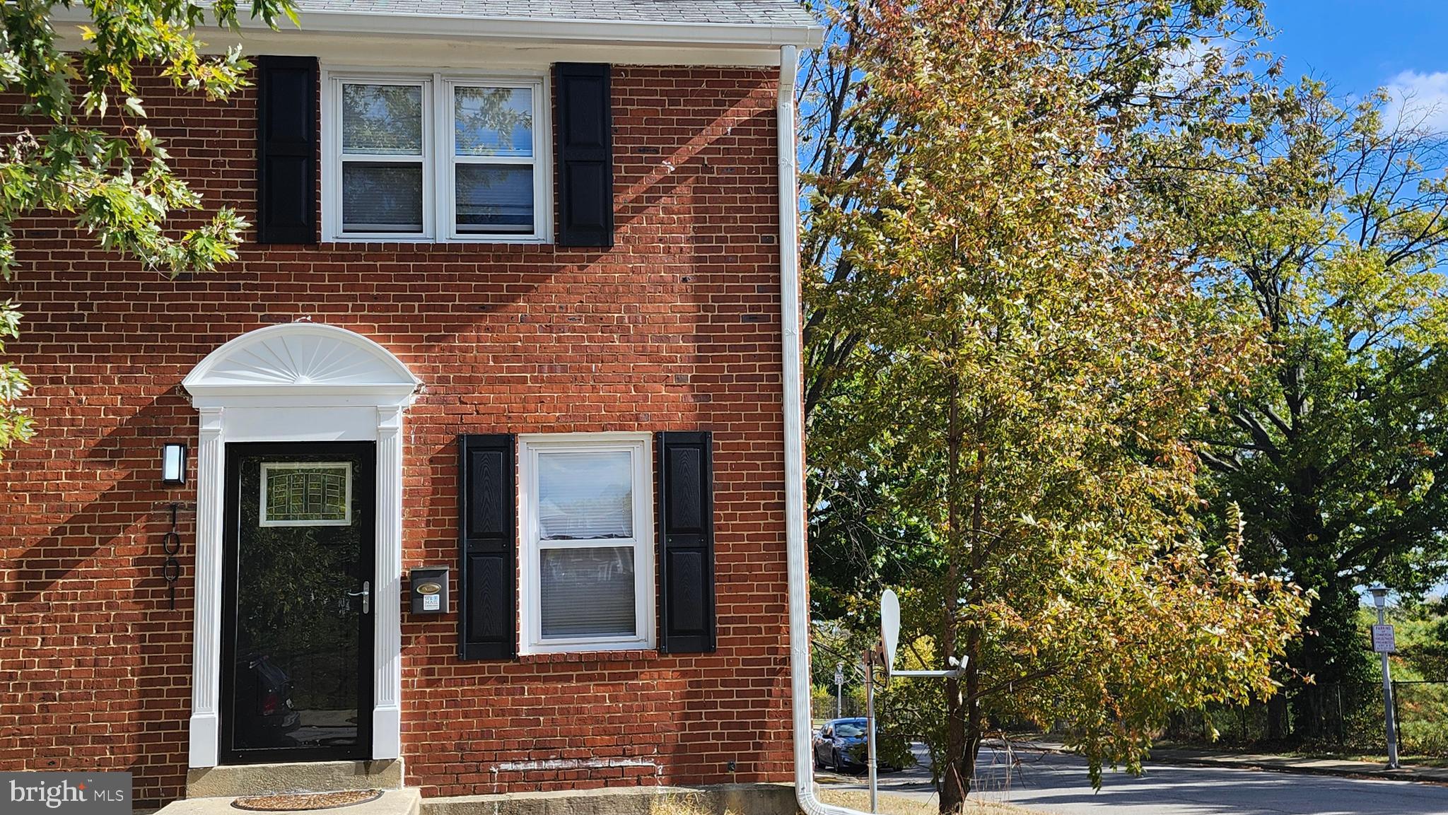 a view of a brick house with a large windows