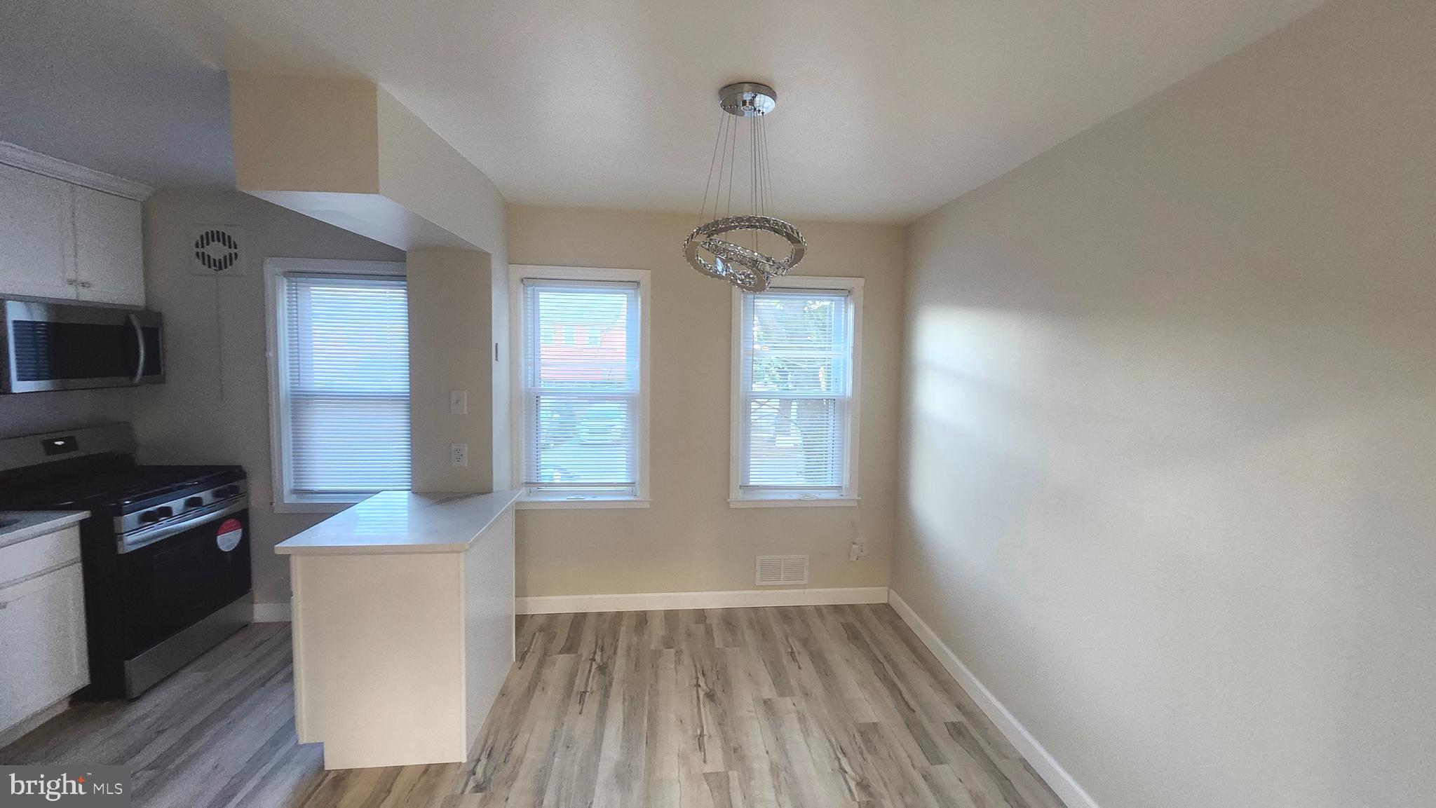 1001 Cameron Road Baltimore, MD 21212 - Photo 13 of 46 wooden floor in an empty room with a window