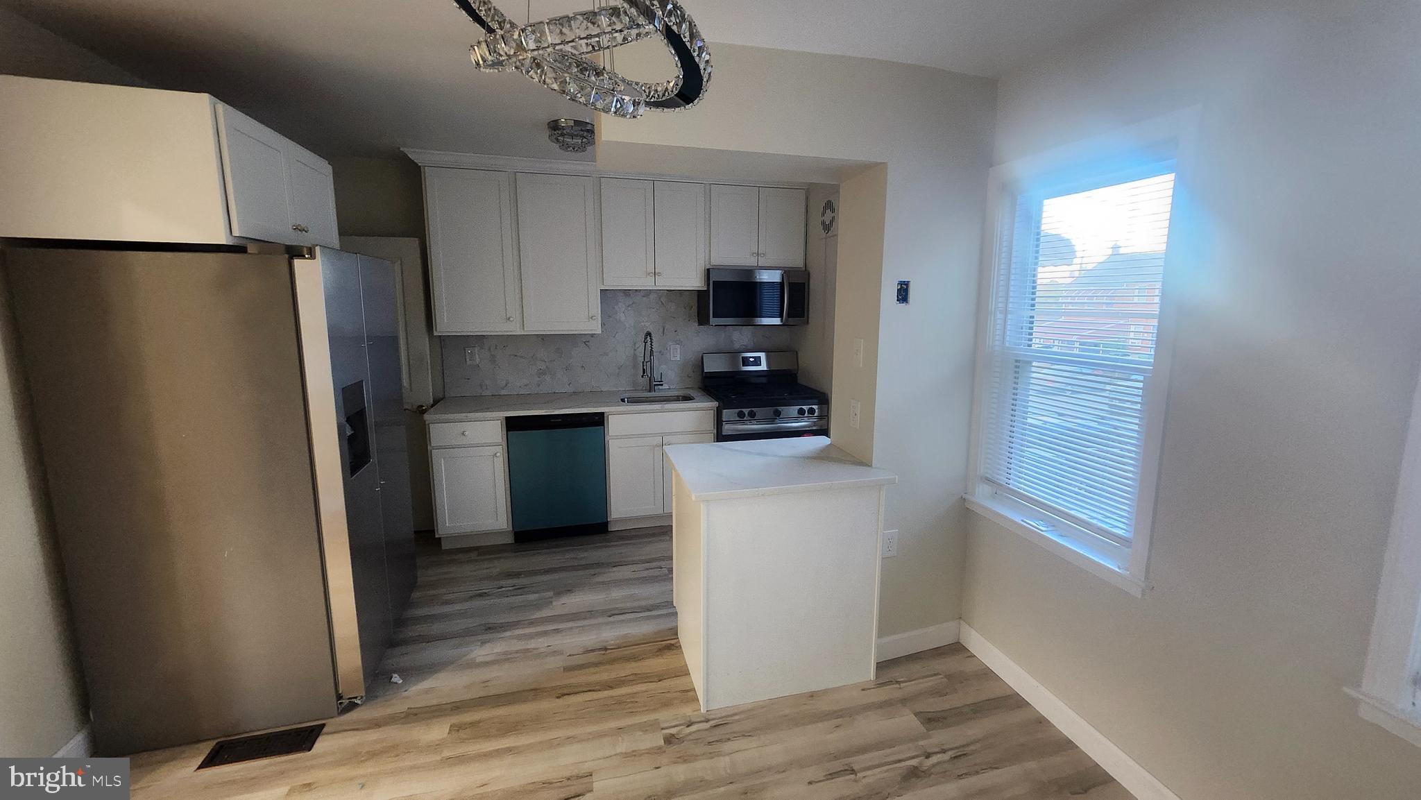 1001 Cameron Road Baltimore, MD 21212 - Photo 15 of 46 a kitchen view with stainless steel appliances a refrigerator and a cabinets