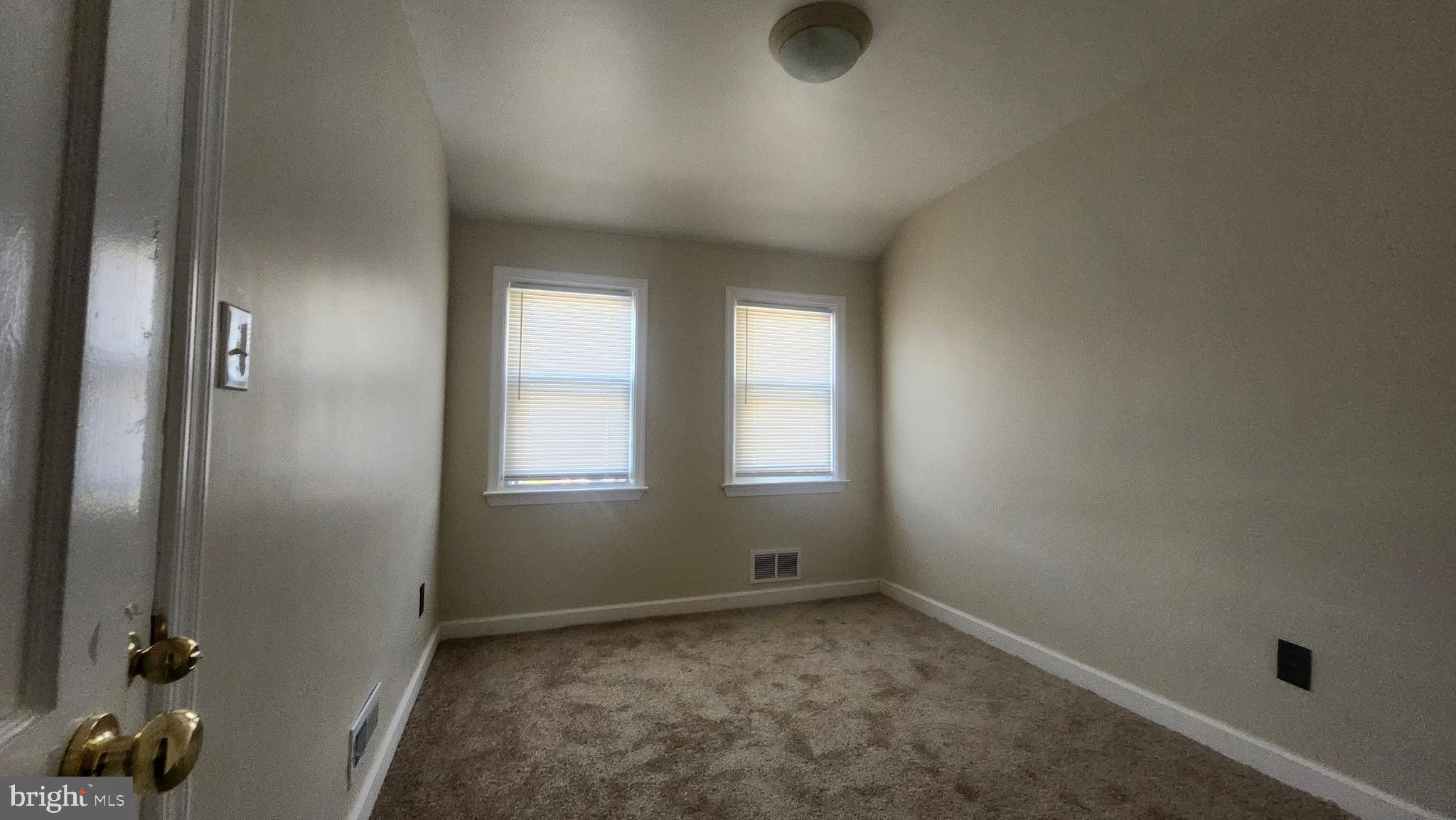 1001 Cameron Road Baltimore, MD 21212 - Photo 30 of 46 an empty room with windows
