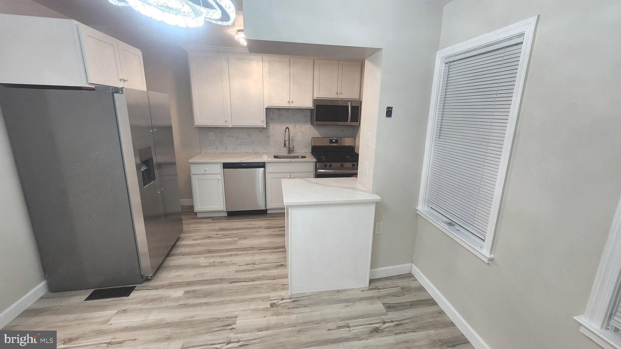 1001 Cameron Road Baltimore, MD 21212 - Photo 3 of 46 a kitchen with a refrigerator a sink and dishwasher