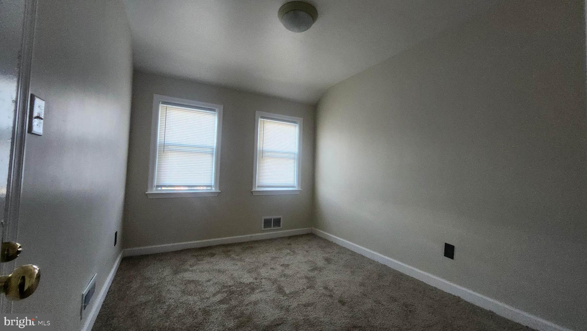 1001 Cameron Road Baltimore, MD 21212 - Photo 31 of 46 an empty room with windows
