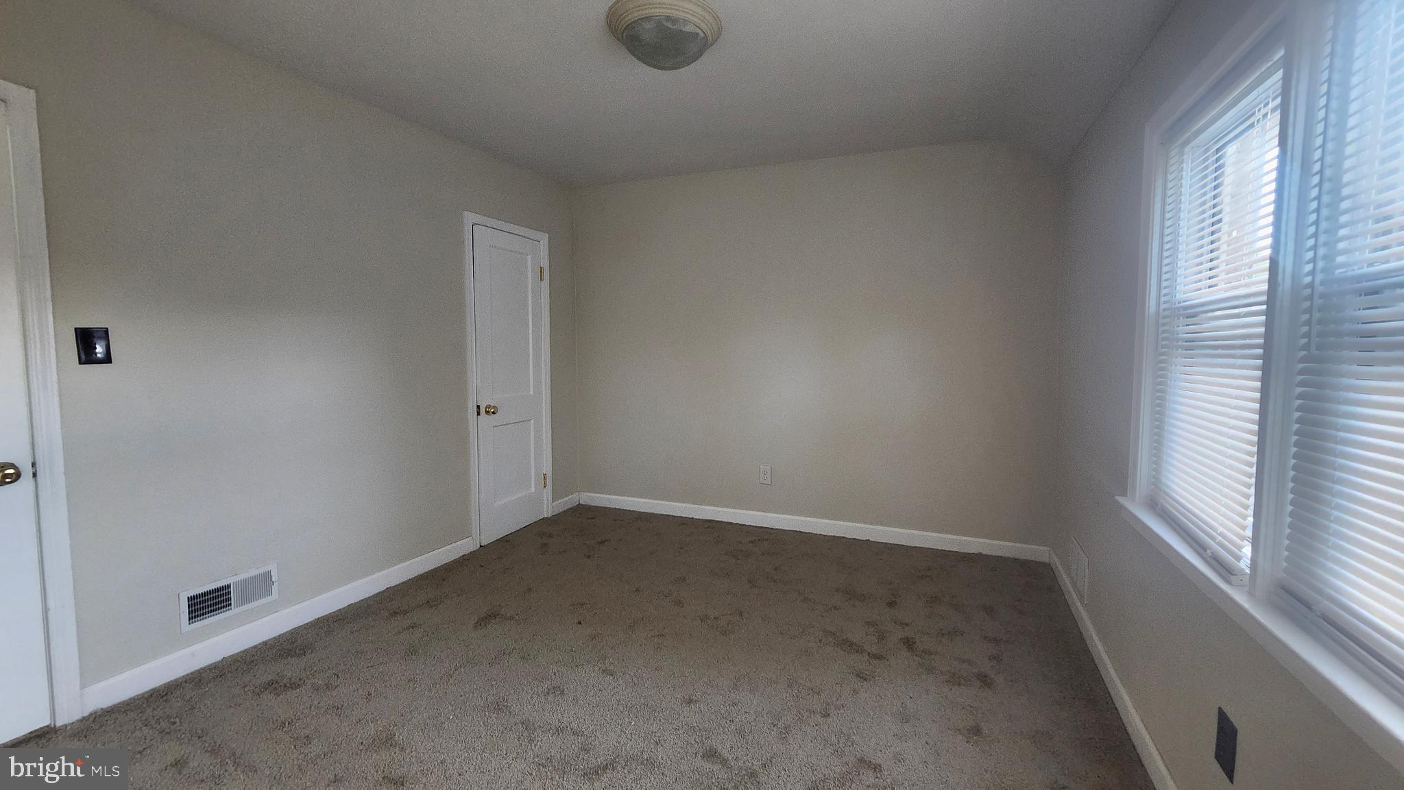 1001 Cameron Road Baltimore, MD 21212 - Photo 33 of 46 an empty room with windows