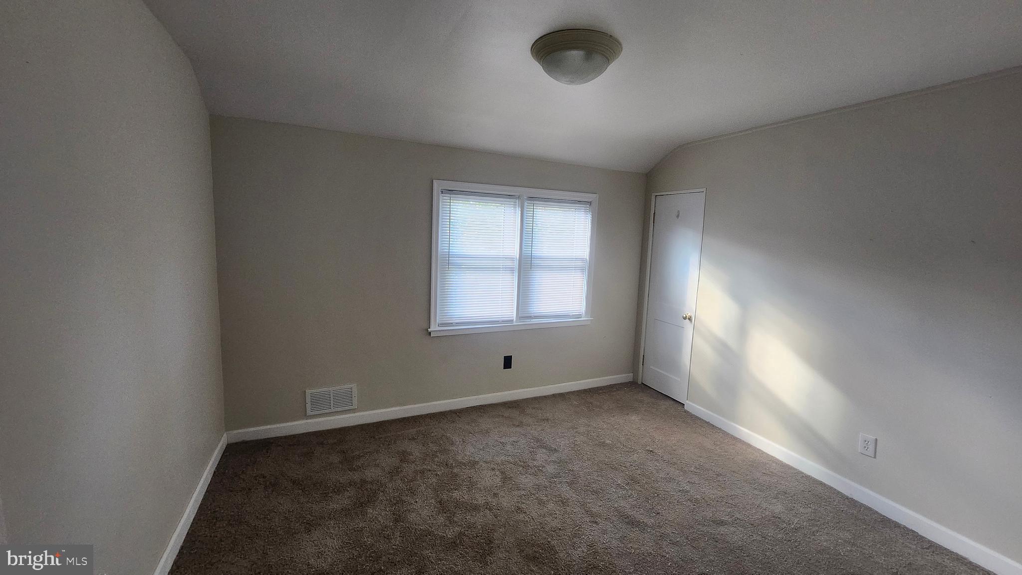 1001 Cameron Road Baltimore, MD 21212 - Photo 35 of 46 an empty room with windows