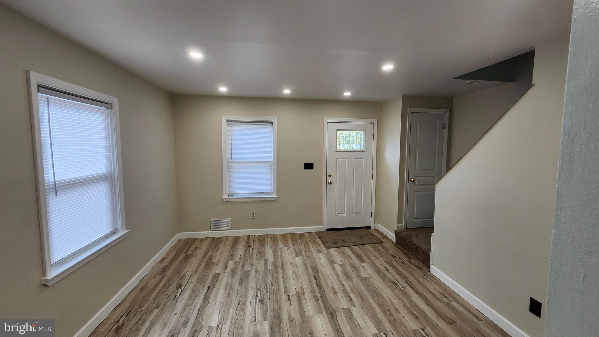 1001 Cameron Road Baltimore, MD 21212 - Photo 40 of 46 a view of hallway with a window and wooden floor