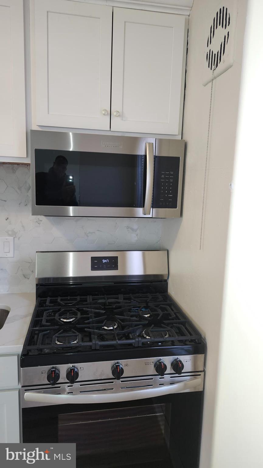 1001 Cameron Road Baltimore, MD 21212 - Photo 41 of 46 a stove top oven sitting inside of a kitchen