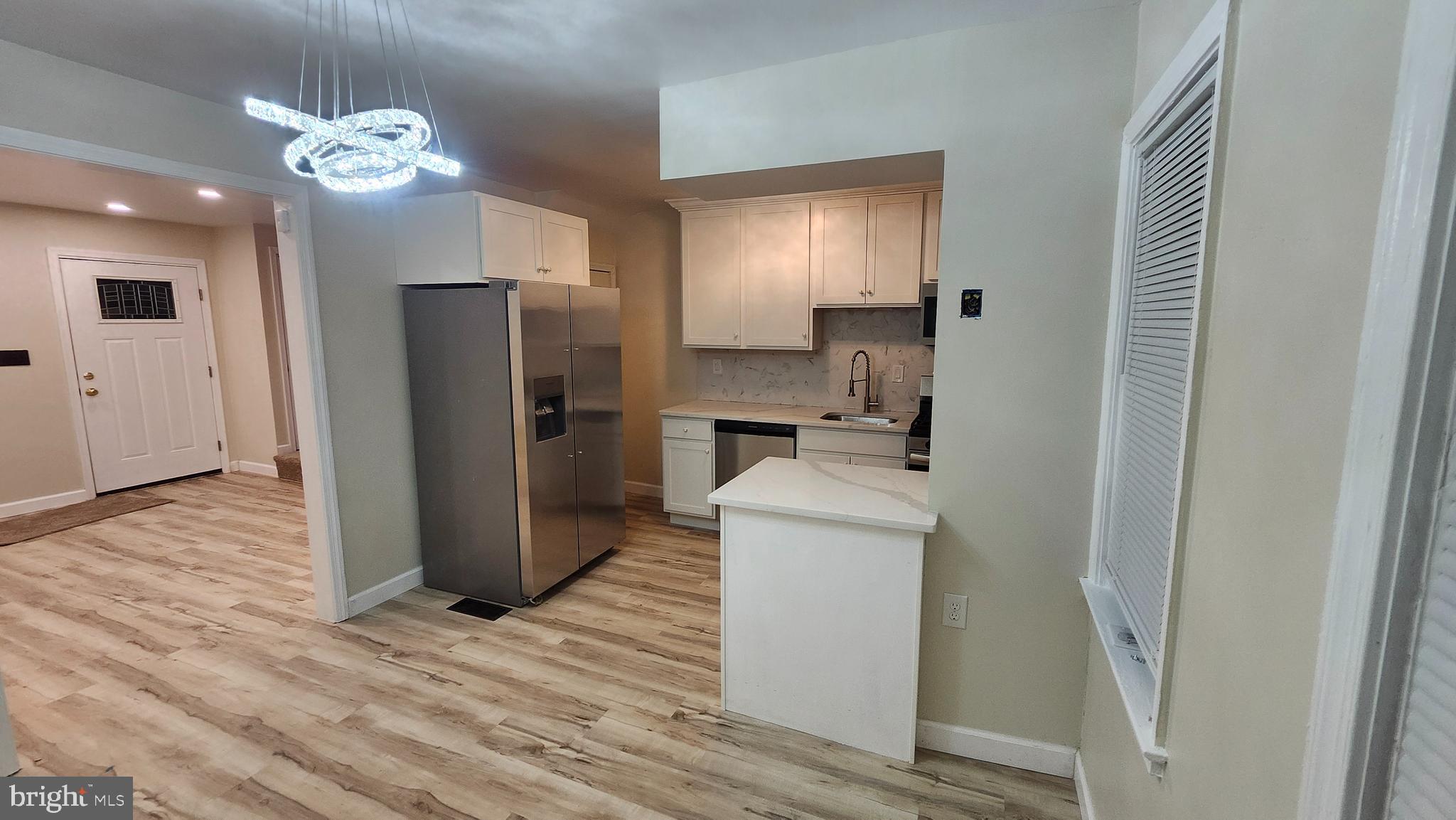 1001 Cameron Road Baltimore, MD 21212 - Photo 45 of 46 a room with stainless steel appliances a refrigerator and microwave