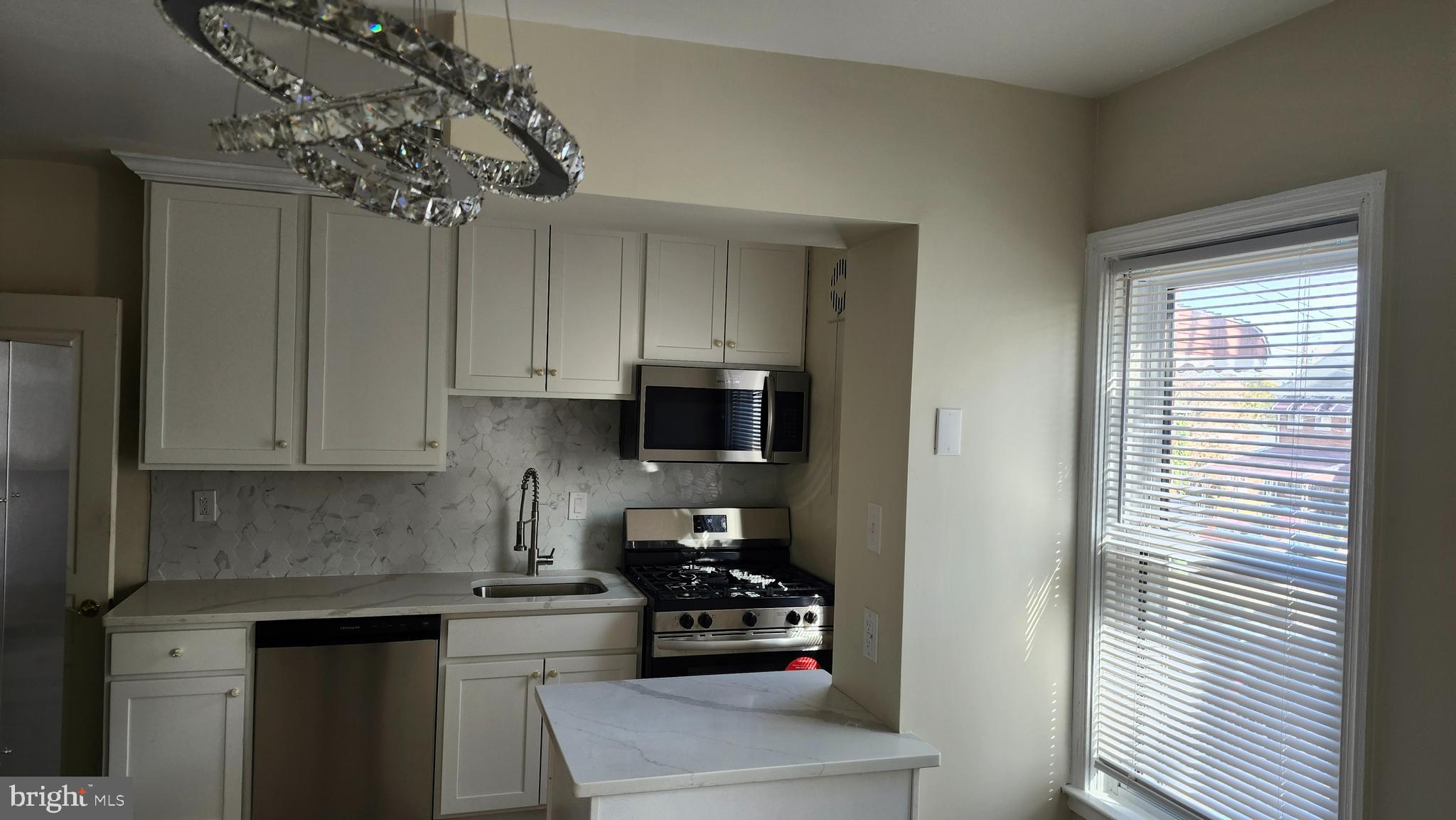 1001 Cameron Road Baltimore, MD 21212 - Photo 46 of 46 a kitchen with a refrigerator and cabinets
