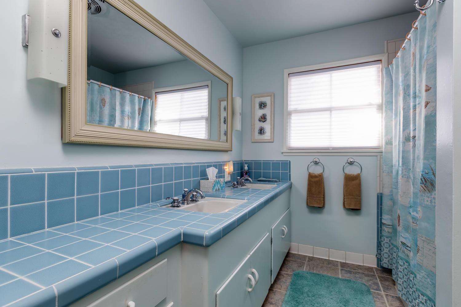 819 Daly Road Ojai, CA 93023 - Photo 12 of 25 a bathroom with a sink and a mirror