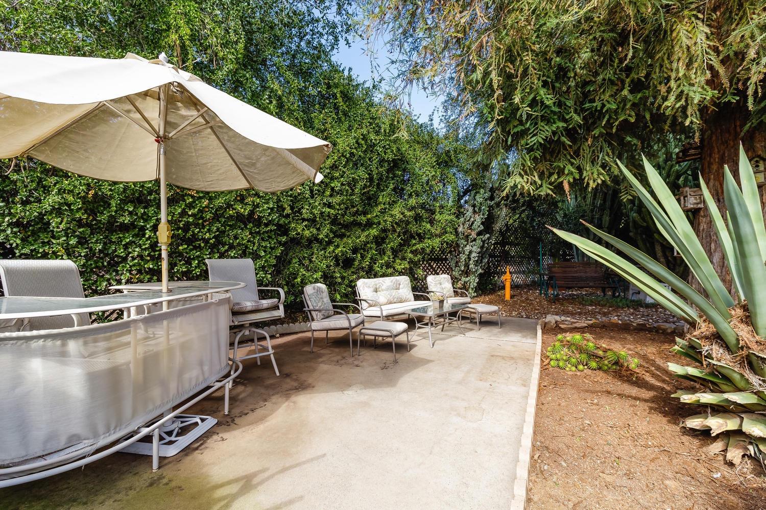 819 Daly Road Ojai, CA 93023 - Photo 19 of 25 an outdoor space with patio and white umbrellas