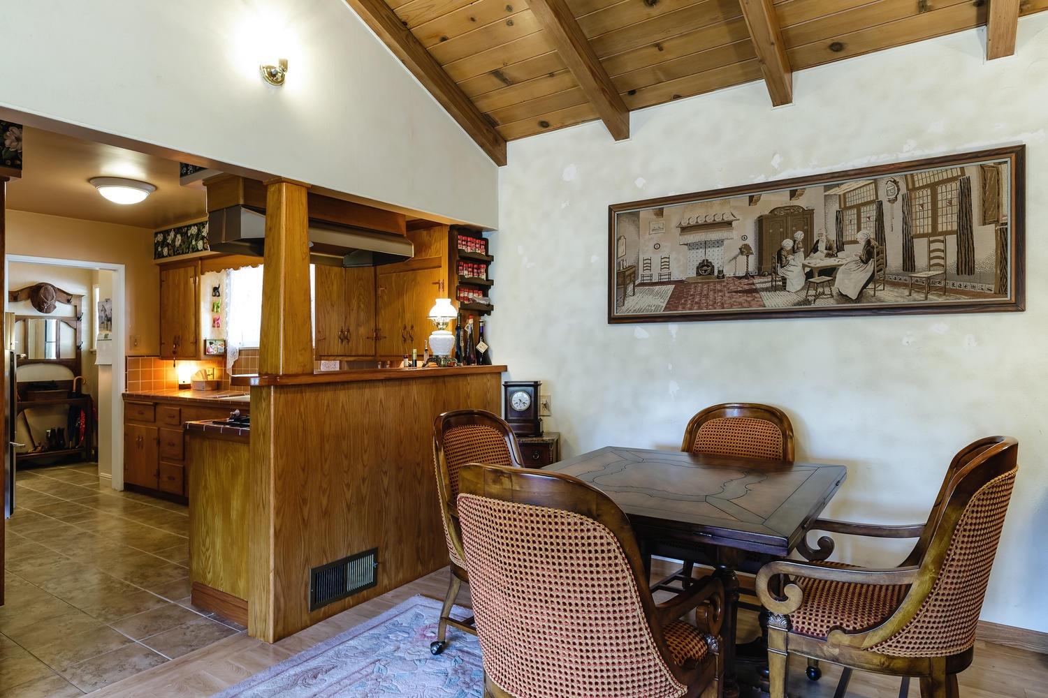 819 Daly Road Ojai, CA 93023 - Photo 8 of 25 a view of a dining room with furniture and wooden floor