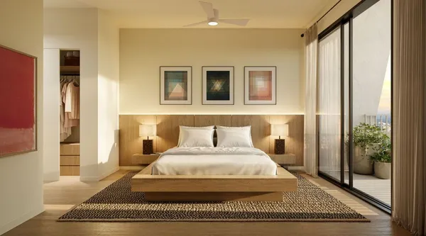 a bedroom with a large bed and a window