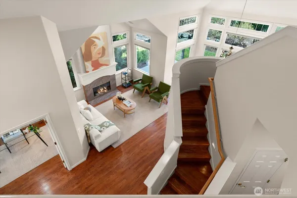 a view of living room with furniture and wooden floor