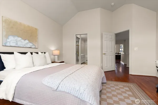 a bedroom with bed and walk in closet
