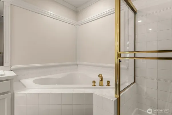 a bathroom with a bathtub and a shower