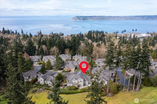 an aerial view of a house with a ocean view