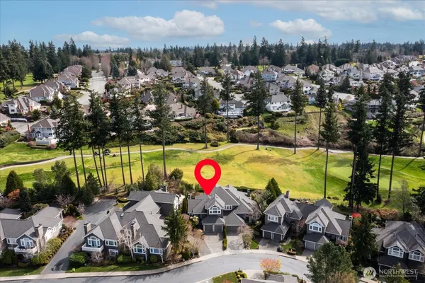 an aerial view of a house with a lake view