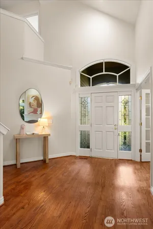 a view of room with window and wooden floor