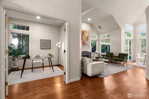 a living room with furniture and wooden floor
