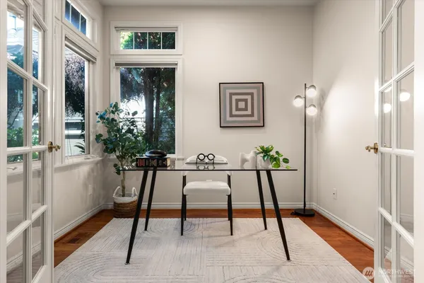a view of a livingroom with furniture and a potted plant