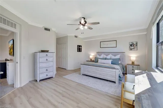 a kitchen with a sink a counter top space appliances and cabinets
