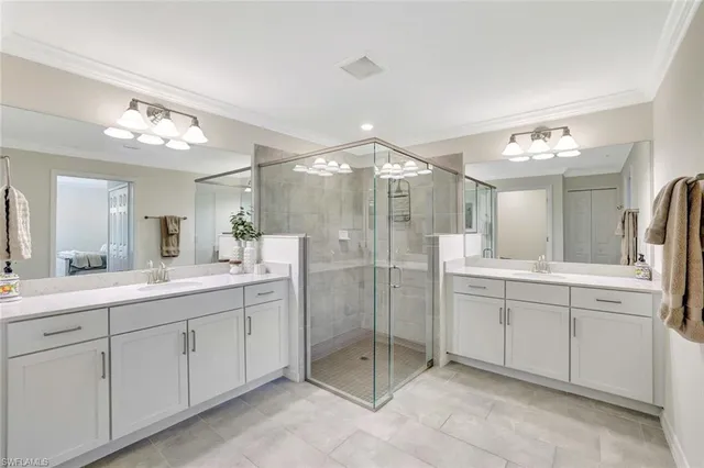a bathroom with a shower sink mirror and toilet