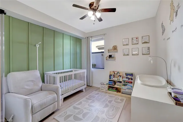 a spacious bathroom with a shower sink and a mirror