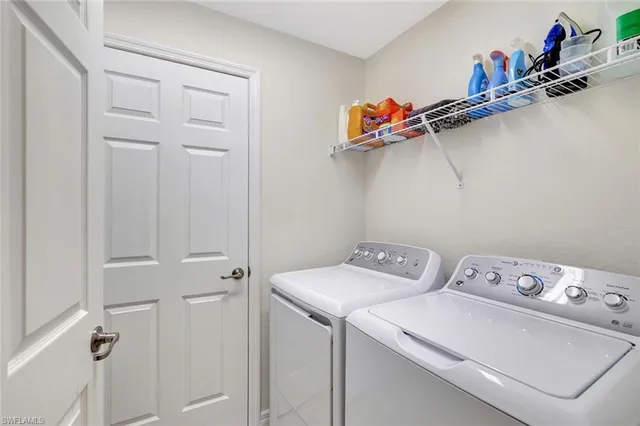 a view of a workspace with furniture and a gym machine