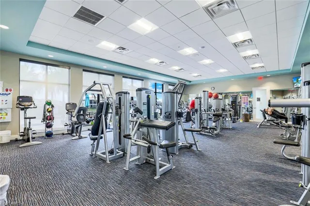 a media room with lots of chairs and mirrors