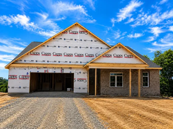 a front view of a building with a yard