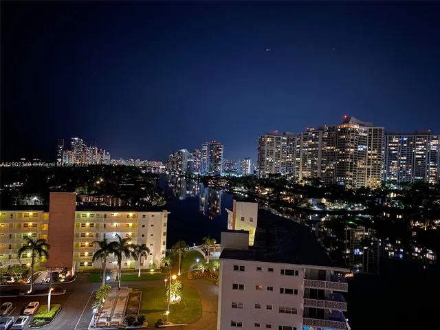 a kitchen with a sink appliances and cabinets