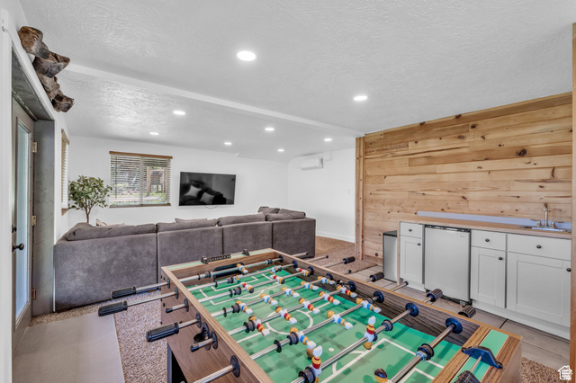 2348 North Miles Holw Road, Unit 26 Kamas, UT 84036 - Photo 18 of 31 Rec room with wooden walls, a textured ceiling, and recessed lighting