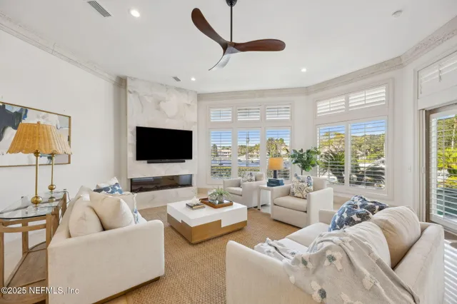 a sign board with tall trees