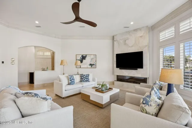 a view of a swimming pool with outdoor seating and city view