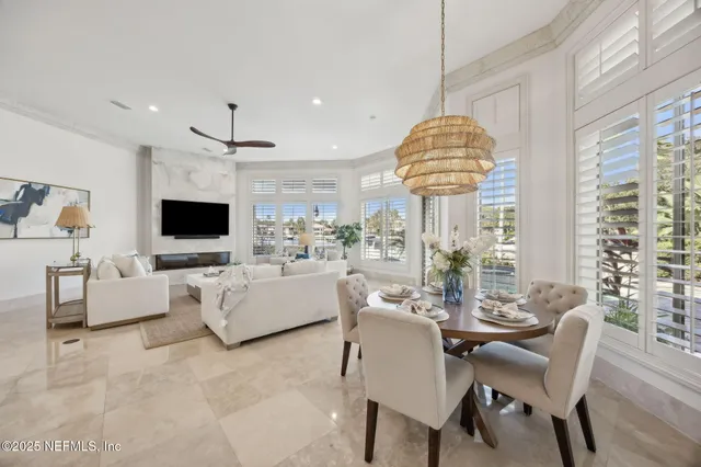 a front view of a house with a garden and trees