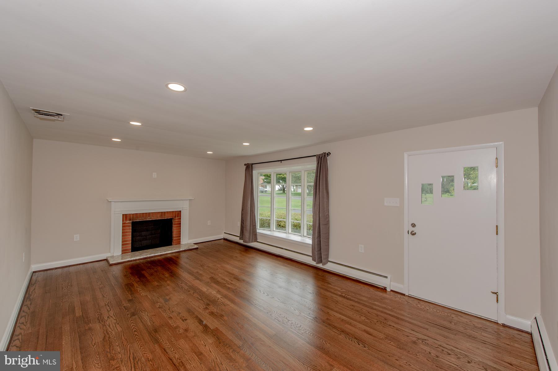 3026 Southview Road Ellicott City, MD 21042 - Photo 7 of 30 LIVING ROOM W/ WOOD BURNING FIREPLACE