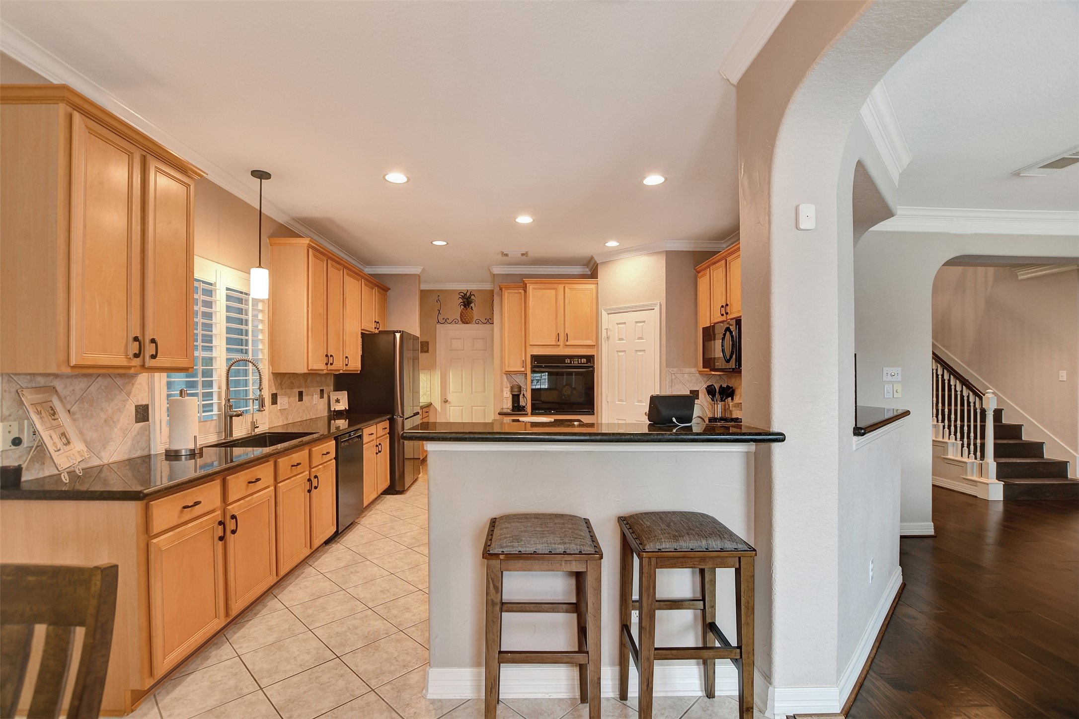 15918 Lake Loop Drive Cypress, TX 77433 - Photo 19 of 50 a kitchen with counter top space a sink and appliances