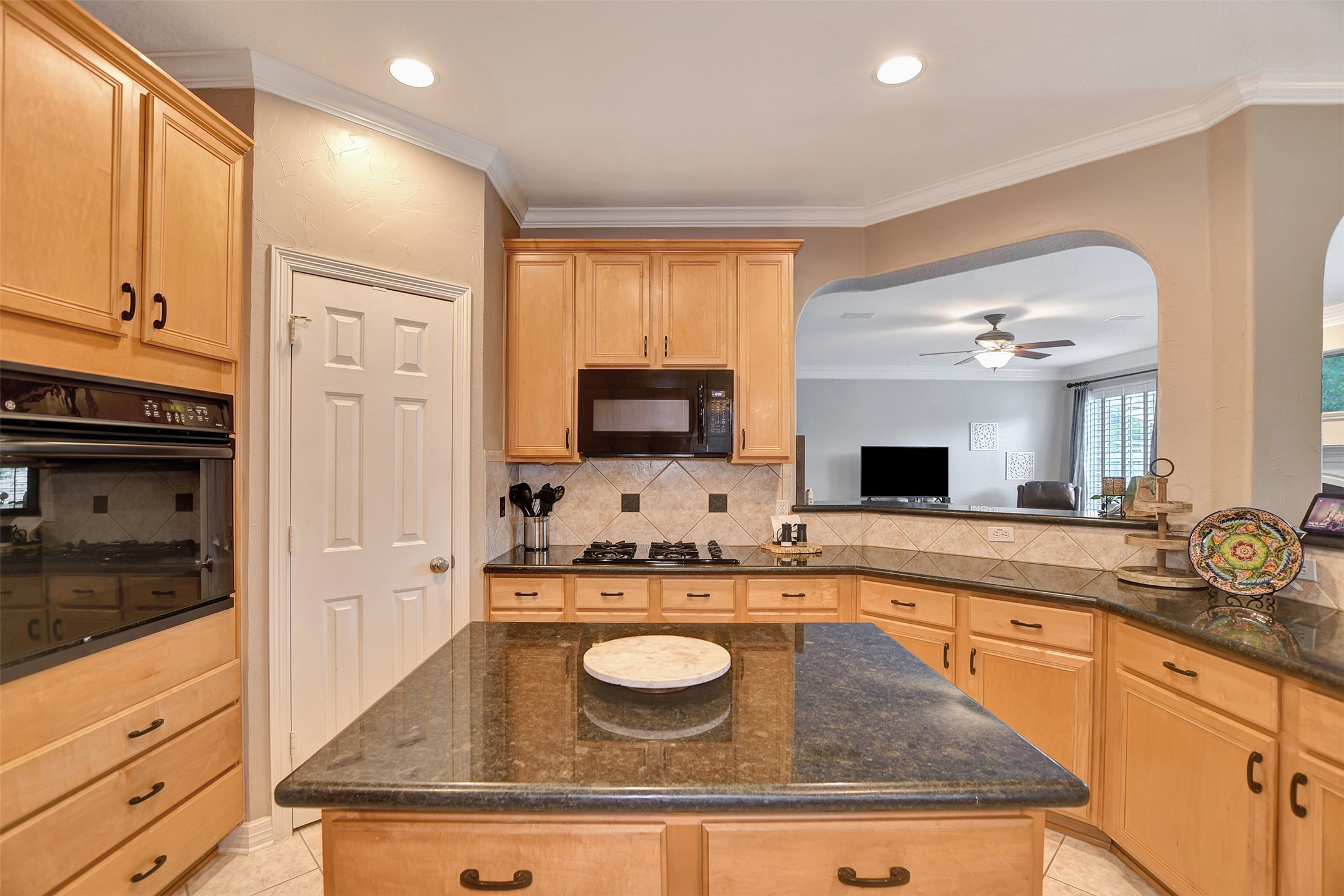 15918 Lake Loop Drive Cypress, TX 77433 - Photo 21 of 50 a kitchen with kitchen island granite countertop a sink a counter top space and stainless steel appliances