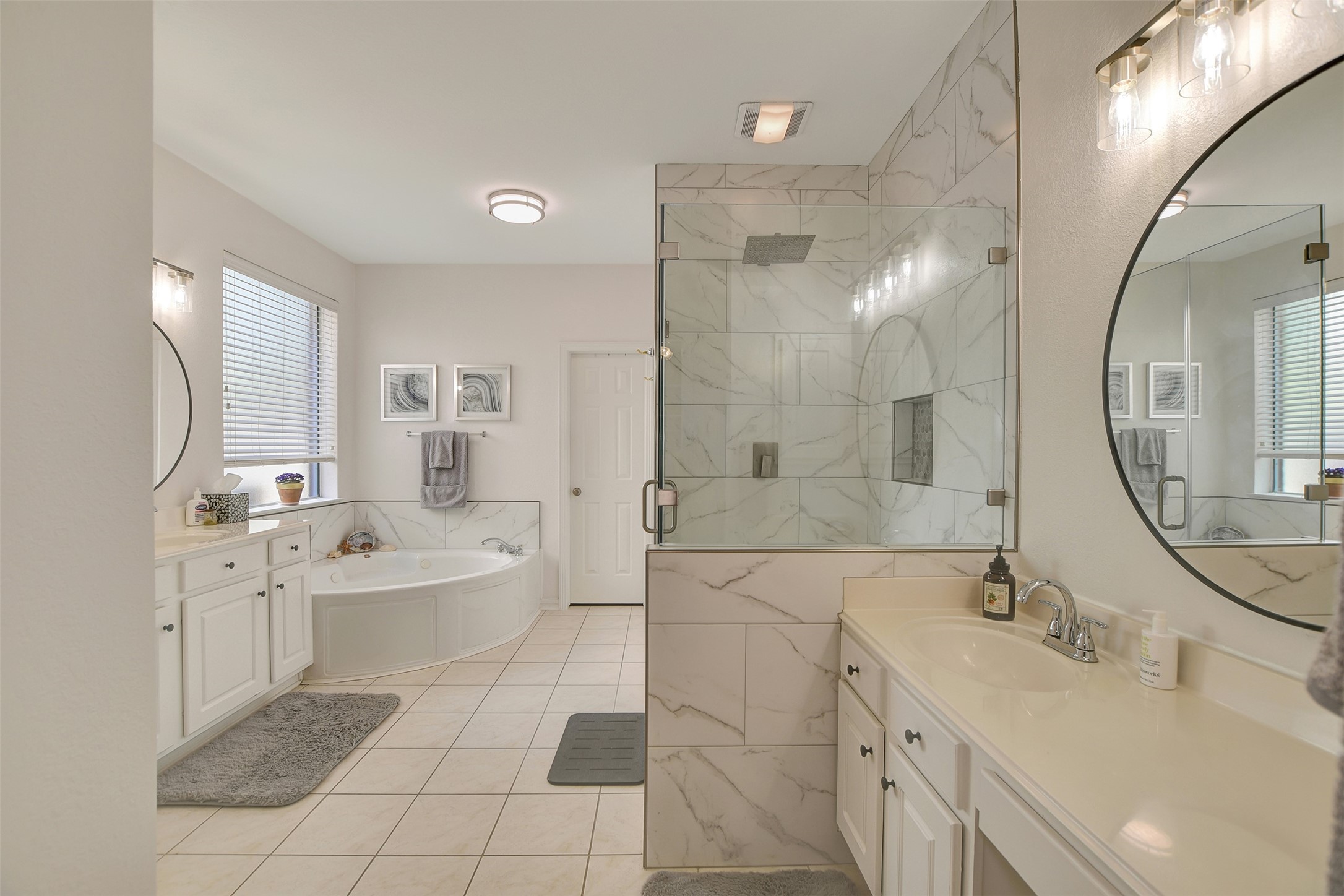 15918 Lake Loop Drive Cypress, TX 77433 - Photo 31 of 50 a spacious bathroom with a double vanity sink mirror and a bathtub