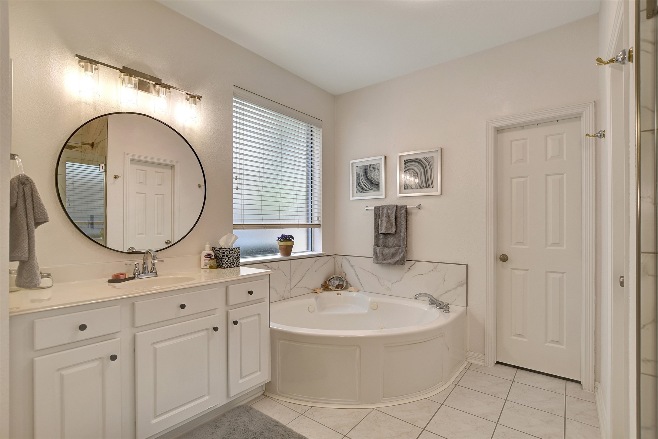 15918 Lake Loop Drive Cypress, TX 77433 - Photo 33 of 50 a bathroom with a sink and a mirror