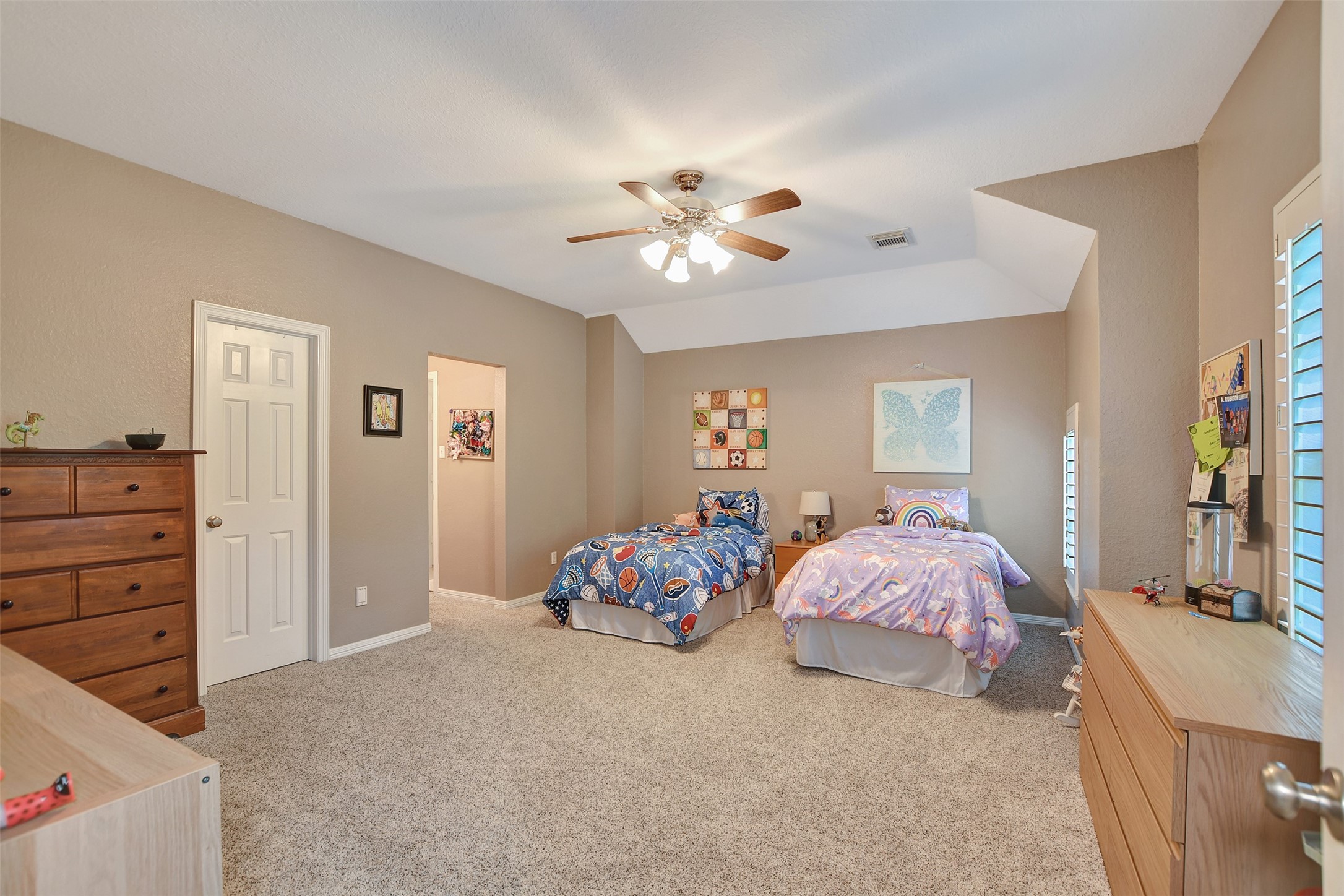 15918 Lake Loop Drive Cypress, TX 77433 - Photo 38 of 50 a bedroom with bed and a chandelier