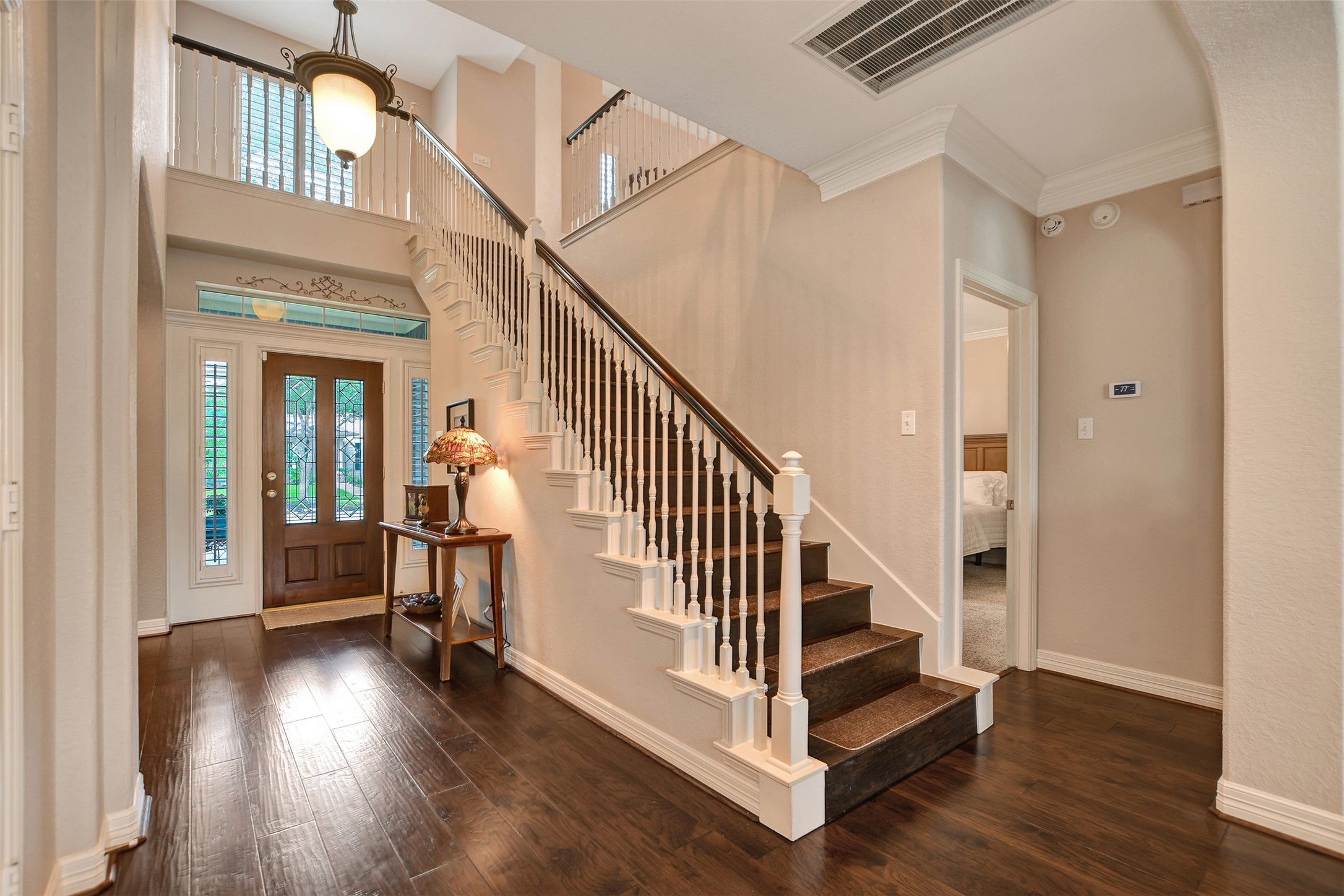 15918 Lake Loop Drive Cypress, TX 77433 - Photo 7 of 50 a view of entryway with wooden floor and stairs