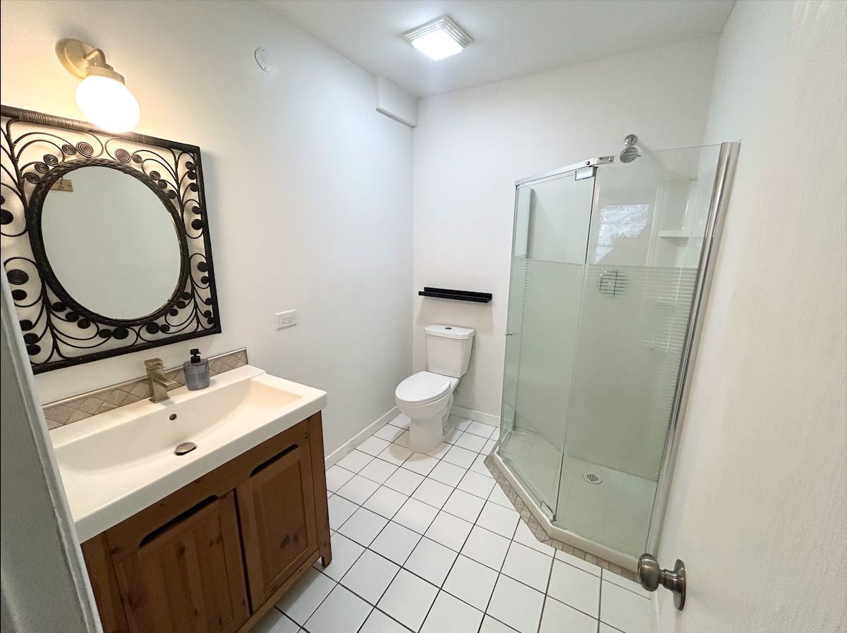 2351 Caton Farm Road Crest Hill, IL 60403 - Photo 13 of 24 a bathroom with a sink a toilet and a mirror