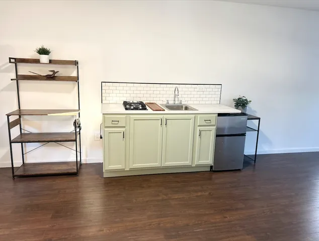 a kitchen with a stove and a microwave
