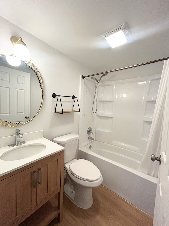 2351 Caton Farm Road Crest Hill, IL 60403 - Photo 7 of 24 a bathroom with a toilet a sink and a mirror