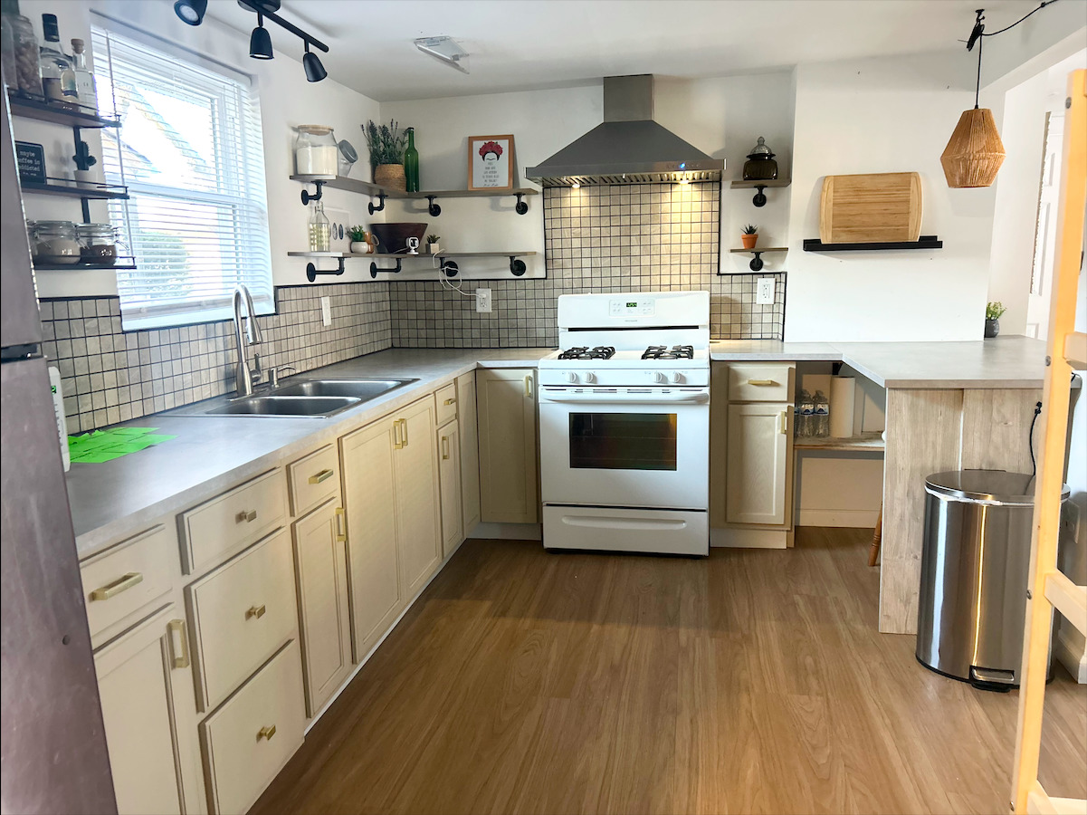 2351 Caton Farm Road Crest Hill, IL 60403 - Photo 9 of 24 a kitchen with stainless steel appliances a sink a stove a refrigerator cabinets and wooden floor
